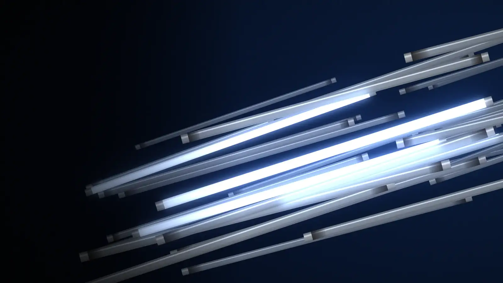 Spent fluorescent tubes on deep navy, a few still lit